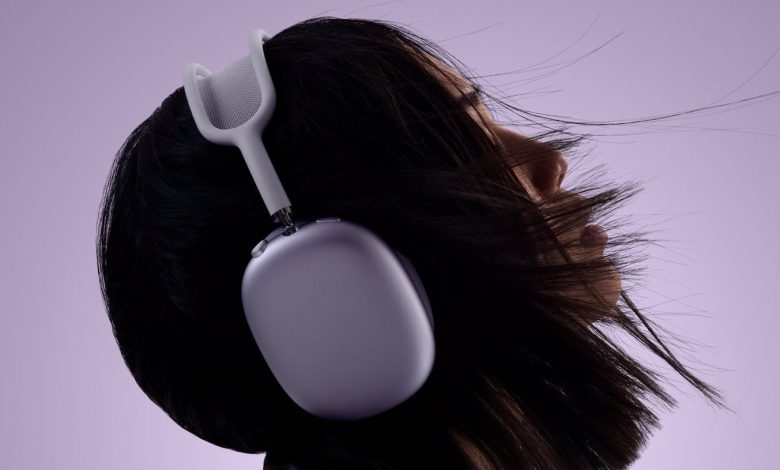 Apple AirPods 2 in purple being worn