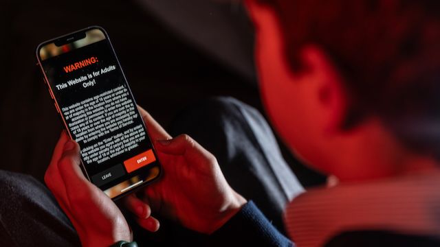 A child attempting to access an age-restricted website, but being blocked