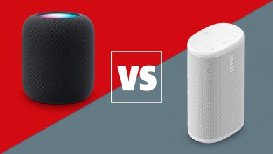 A black Apple HomePod 2 and white Sonos Play speaker on a red and grey background with a white versus sign between them.