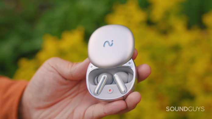 a hand holding the Viaim RecDot earbuds. hero image.